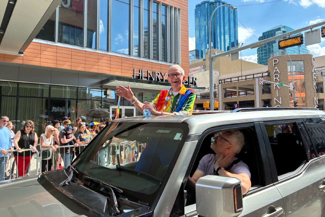 Ron Byers waving in Pride Parade 2025